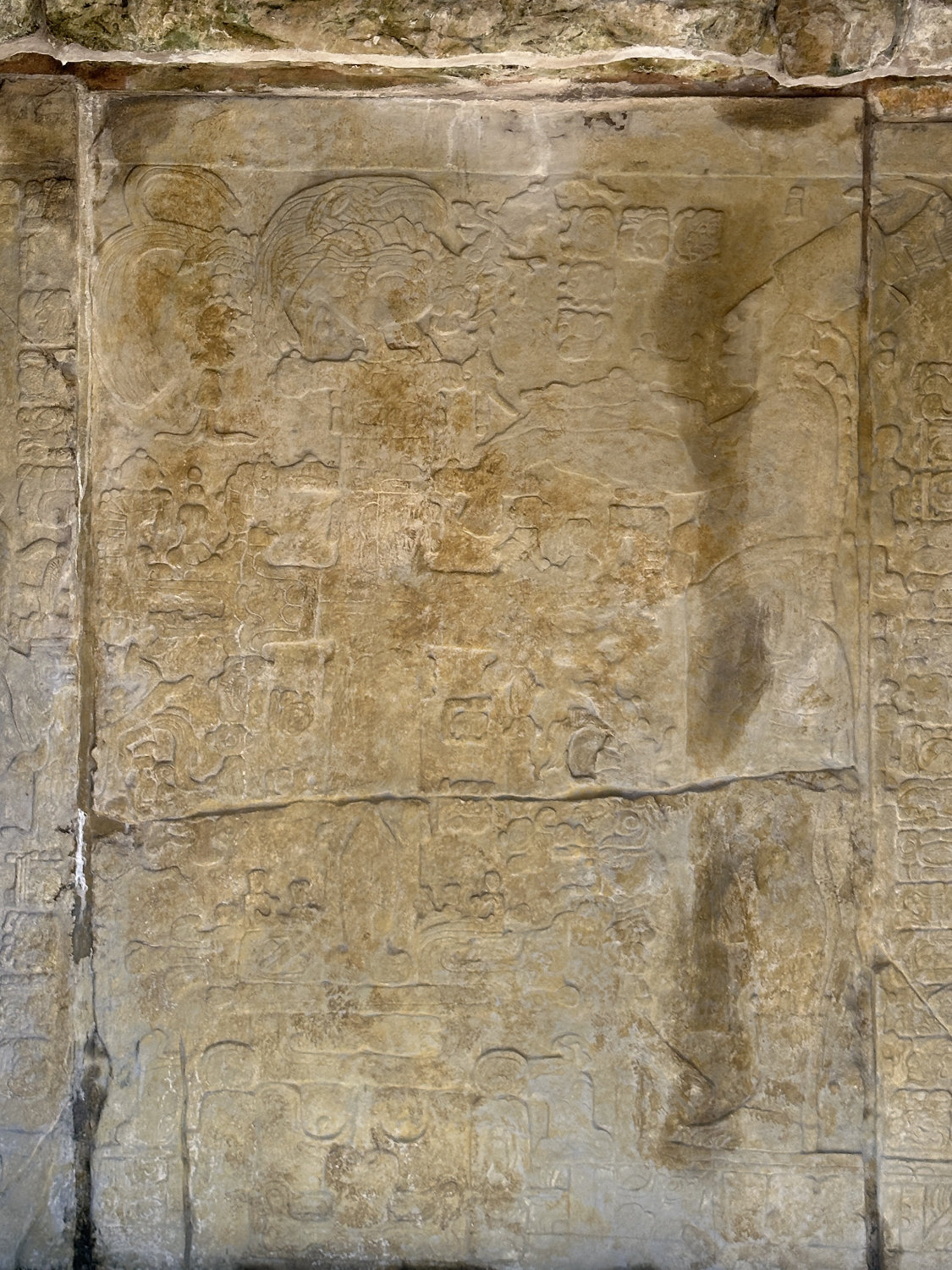 Close-up of Maya hieroglyphs and carved figures at the Temple of the Cross