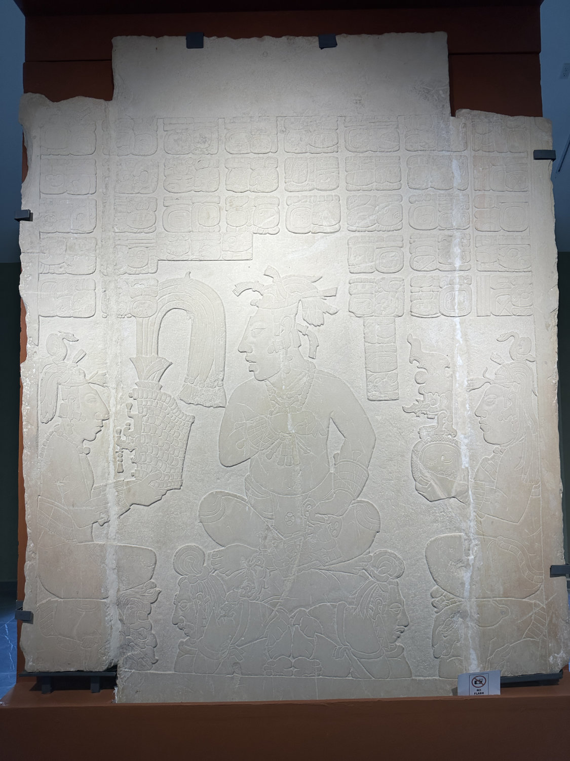 Carved stone panel showing Maya nobility from museum collection