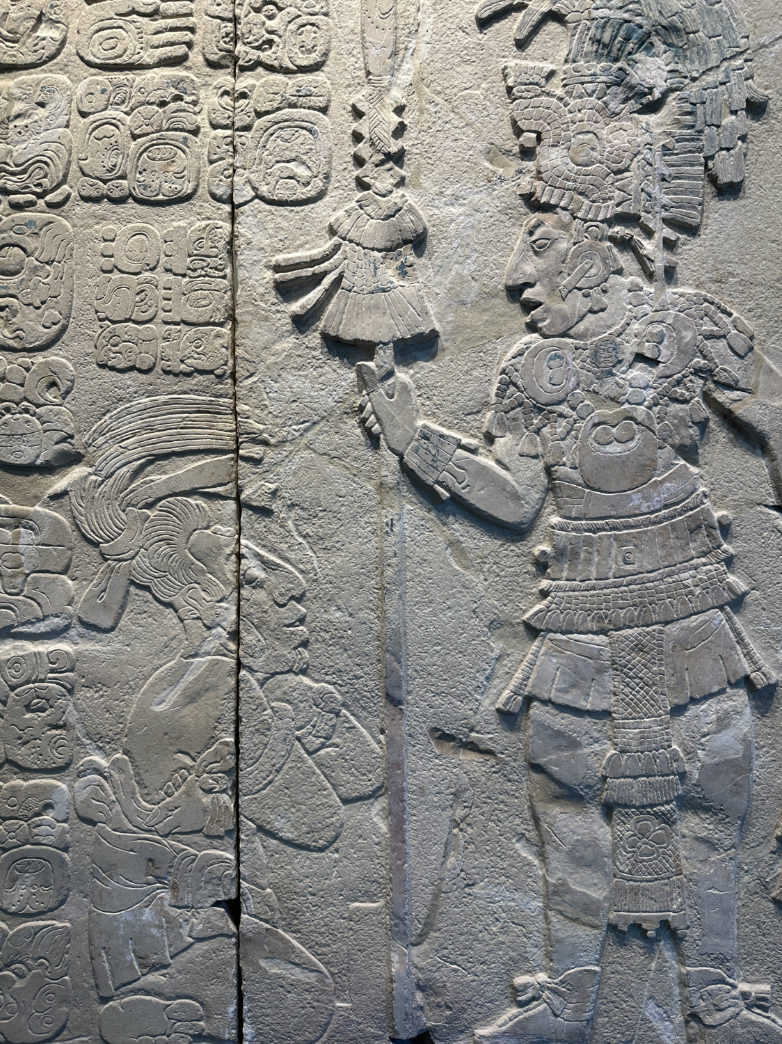 Carved stone panel showing Maya nobility from museum collection